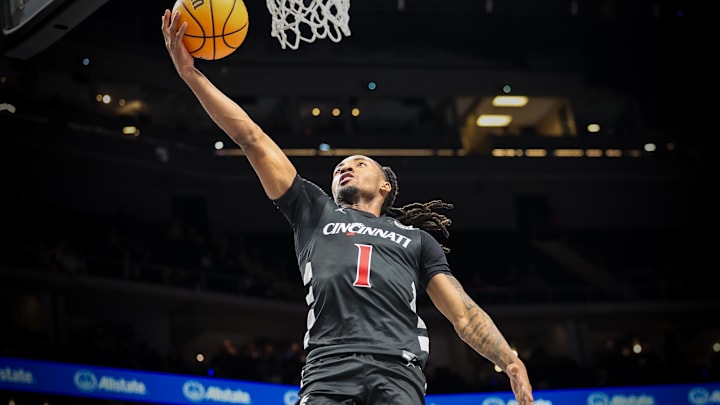 Mar 12, 2025; Kansas City, MO, USA; Cincinnati Bearcats guard Day Day Thomas (1) shoots the ball during the second half against the Cincinnati Bearcats at T-Mobile Center. Mandatory Credit: William Purnell-Imagn Images