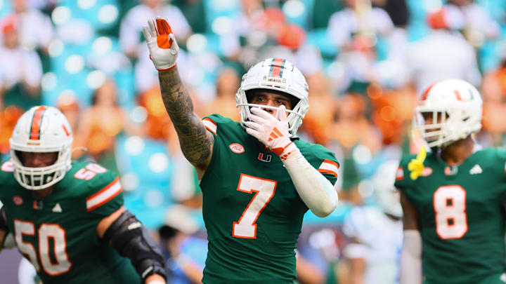 Nov 2, 2024; Miami Gardens, Florida, USA; Miami Hurricanes wide receiver Xavier Restrepo (7) celebrates after a touchdown by wide receiver Jacolby George (not pictured) against the Duke Blue Devils during the fourth quarter at Hard Rock Stadium. Mandatory Credit: Sam Navarro-Imagn Images