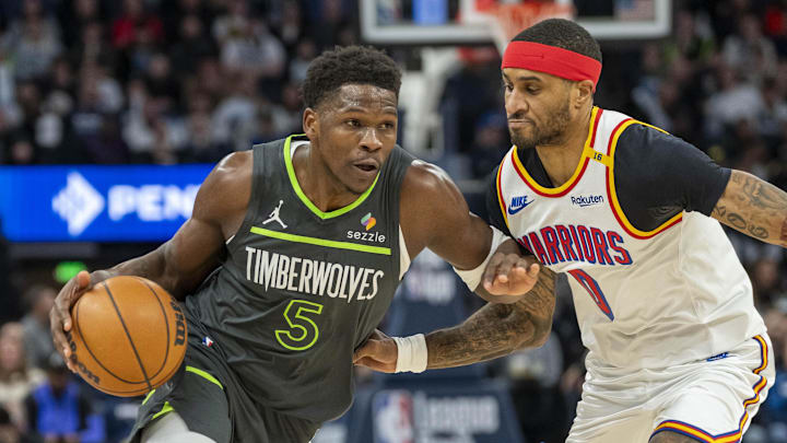 Minnesota Timberwolves guard Anthony Edwards dribbles the ball as Golden State Warriors guard Gary Payton II plays defense in the first half at Target Center in Minneapolis on Jan. 15, 2025. Minnesota Timberwolves guard Anthony Edwards dribbles the ball as Golden State Warriors guard Gary Payton II plays defense in the first half at Target Center in Minneapolis on Jan. 15, 2025.