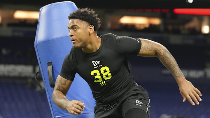 Auburn defensive lineman Keldric Faulk runs through on-field defensive line drills at the NFL Scouting Combine. Auburn defensive lineman Keldric Faulk runs through on-field defensive line drills at the NFL Scouting Combine.