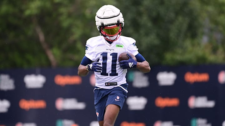 Jul 24, 2024; Foxborough, MA, USA;  New England Patriots wide receiver Tyquan Thornton (11) runs after making a catch during training camp at Gillette Stadium.