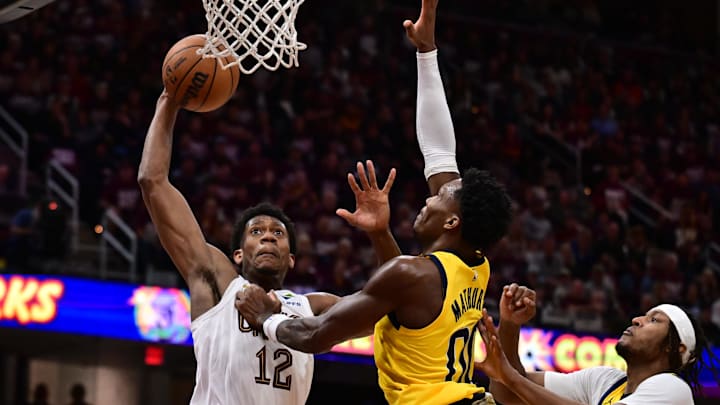 May 4, 2025; Cleveland, Ohio, USA; Cleveland Cavaliers forward De'Andre Hunter (12) drives to the basket against Indiana Pacers guard Bennedict Mathurin (00) during the second half in game one of the second round for the 2025 NBA Playoffs at Rocket Arena. Mandatory Credit: Ken Blaze-Imagn Images