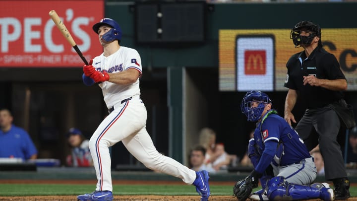 Jun 22, 2024; Arlington, Texas, USA; Texas Rangers left fielder Wyatt Langford (36) hits a grand slam home run in the eighth inning against the Kansas City Royals at Globe Life Field. Mandatory Credit: Tim Heitman-USA TODAY Sports