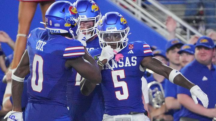 Sep 4, 2026; Lawrence, Kansas, USA; Kansas Jayhawks wide receiver Nik McMillan (5) celebrates with wide receiver Nahzae Cox (0) after scoring against the LIU Sharks during the first half at David Booth Kansas Memorial Stadium. Mandatory Credit: Denny Medley-Imagn Images Sep 4, 2026; Lawrence, Kansas, USA; Kansas Jayhawks wide receiver Nik McMillan (5) celebrates with wide receiver Nahzae Cox (0) after scoring against the LIU Sharks during the first half at David Booth Kansas Memorial Stadium. Mandatory Credit: Denny Medley-Imagn Images