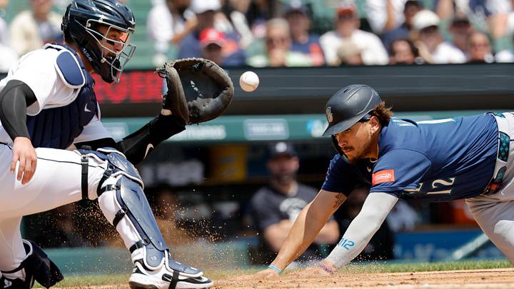 Jun 6, 2026; Detroit, Michigan, USA; Seattle Mariners first baseman Josh Naylor (12) dives in safe at home ahead of the tag by Detroit Tigers catcher Dillon Dingler (13) in the third inning at Comerica Park. Mandatory Credit: Rick Osentoski-Imagn Images Jun 6, 2026; Detroit, Michigan, USA; Seattle Mariners first baseman Josh Naylor (12) dives in safe at home ahead of the tag by Detroit Tigers catcher Dillon Dingler (13) in the third inning at Comerica Park. Mandatory Credit: Rick Osentoski-Imagn Images