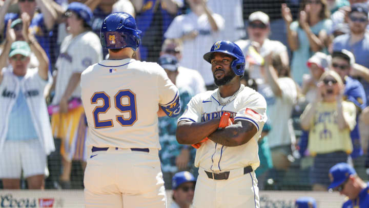 Aug 10, 2025; Seattle, Washington, USA; Seattle Mariners designated hitter Cal Raleigh (29) celebrates with left fielder Randy Arozarena (56) after hitting a two-run against the Tampa Bay Rays during the first inning at T-Mobile Park. Arozarena scored a run on the hit. Mandatory Credit: Joe Nicholson-Imagn Images