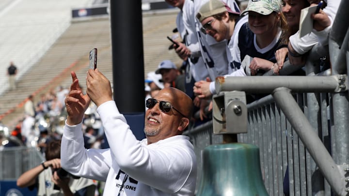 Penn State football James Franklin takes a selfie with students following the Blue-White Game at Beaver Stadium. 