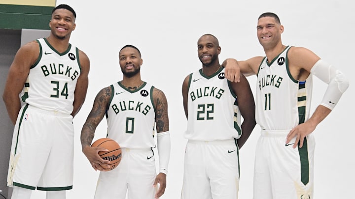 Oct 2, 2023; Milwaukee, WI, USA; Milwaukee Bucks forward Giannis Antetokounmpo (34), guard Damian Lillard (0), forward Khris Middleton (22), and center Brook Lopez (11) pose for a picture during media day in Milwaukee. Mandatory Credit: Benny Sieu-Imagn Images Oct 2, 2023; Milwaukee, WI, USA; Milwaukee Bucks forward Giannis Antetokounmpo (34), guard Damian Lillard (0), forward Khris Middleton (22), and center Brook Lopez (11) pose for a picture during media day in Milwaukee. Mandatory Credit: Benny Sieu-Imagn Images