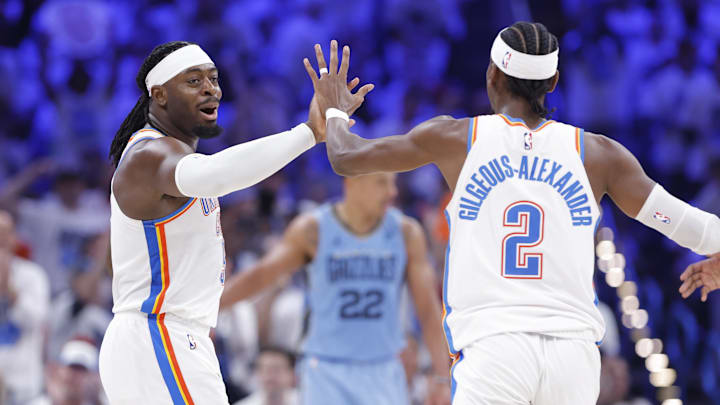 Apr 20, 2025; Oklahoma City, Oklahoma, USA; Oklahoma City Thunder guard Luguentz Dort (5) high fives guard Shai Gilgeous-Alexander (2) after scoring a three point basket against the Memphis Grizzlies during the second half at Paycom Center. Mandatory Credit: Alonzo Adams-Imagn Images Apr 20, 2025; Oklahoma City, Oklahoma, USA; Oklahoma City Thunder guard Luguentz Dort (5) high fives guard Shai Gilgeous-Alexander (2) after scoring a three point basket against the Memphis Grizzlies during the second half at Paycom Center. Mandatory Credit: Alonzo Adams-Imagn Images