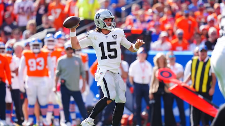 Oct 6, 2024; Denver, Colorado, USA; Las Vegas Raiders quarterback Gardner Minshew (15) prepares to pass in the second quarter against the Denver Broncos at Empower Field at Mile High. Mandatory Credit: Ron Chenoy-Imagn Images