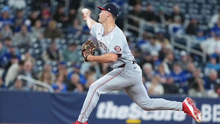 Apr 2, 2025; Toronto, Ontario, CAN; Washington Nationals relief pitcher Brad Lord (61) throws a pitch against the Toronto Blue Jays during the sixth inning at Rogers Centre. 