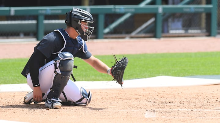 Dillon Dingler catches a ball at Detroit Tigers Summer Workouts.
