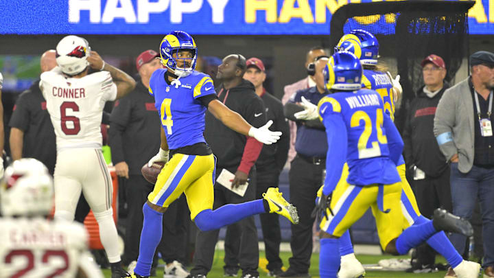 Dec 28, 2024; Inglewood, California, USA; Los Angeles Rams cornerback Ahkello Witherspoon (4) celebrates after an interception in the end zone against the Arizona Cardinals in the fourth quarter at SoFi Stadium. Mandatory Credit: Jayne Kamin-Oncea-Imagn Images