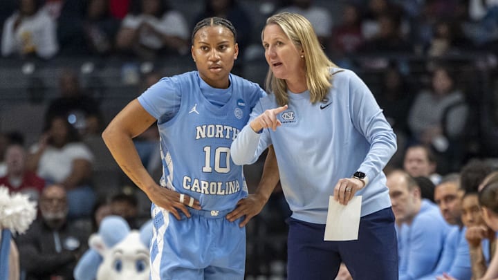Mar 28, 2025; Birmingham, AL, USA; North Carolina Tar Heels head coach Courtney Banghart works with guard Reniya Kelly (10) during the Sweet 16 NCAA Tournament basketball game against the Duke Blue Devils at Legacy Arena. Mandatory Credit: Vasha Hunt-Imagn Images Mar 28, 2025; Birmingham, AL, USA; North Carolina Tar Heels head coach Courtney Banghart works with guard Reniya Kelly (10) during the Sweet 16 NCAA Tournament basketball game against the Duke Blue Devils at Legacy Arena. Mandatory Credit: Vasha Hunt-Imagn Images