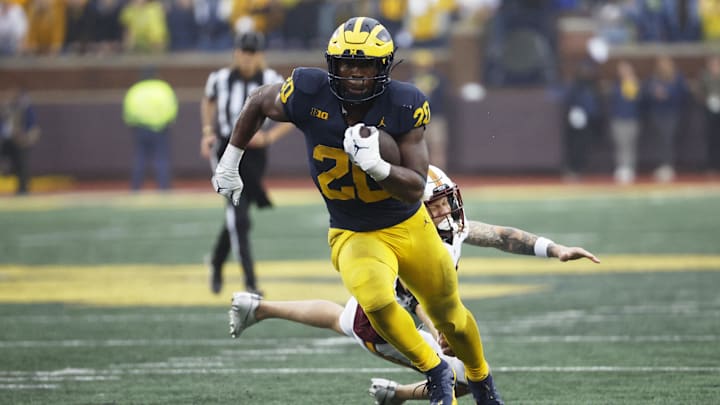 Sep 28, 2024; Ann Arbor, Michigan, USA;  Michigan Wolverines running back Kalel Mullings (20) rushes in the second half against the Minnesota Golden Gophers at Michigan Stadium. Mandatory Credit: Rick Osentoski-Imagn Images