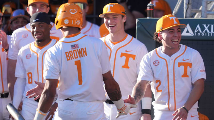 Tennessee players cheer after Blaine Brown (1) scores the game and his first run during an NCAA college baseball game against Nicholls on Feb. 13, 2026, in Knoxville, Tennessee.