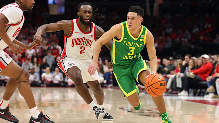 Jan 9, 2025; Columbus, Ohio, USA;  Oregon Ducks guard Jackson Shelstad (3) dribbles the ball past Ohio State Buckeyes guard Bruce Thornton (2) during the first half at Value City Arena. Mandatory Credit: Joseph Maiorana-Imagn Images