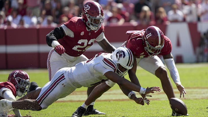 Oct 12, 2024; Tuscaloosa, Alabama, USA; South Carolina Gamecocks quarterback LaNorris Sellers (16) fights for a fumble with Alabama Crimson Tide defensive lineman LT Overton (22) and Alabama Crimson Tide linebacker Jihaad Campbell (11) at Bryant-Denny Stadium. Alabama defeated South Carolina 27-25. Mandatory Credit: Gary Cosby Jr.-Imagn Images Oct 12, 2024; Tuscaloosa, Alabama, USA; South Carolina Gamecocks quarterback LaNorris Sellers (16) fights for a fumble with Alabama Crimson Tide defensive lineman LT Overton (22) and Alabama Crimson Tide linebacker Jihaad Campbell (11) at Bryant-Denny Stadium. Alabama defeated South Carolina 27-25. Mandatory Credit: Gary Cosby Jr.-Imagn Images
