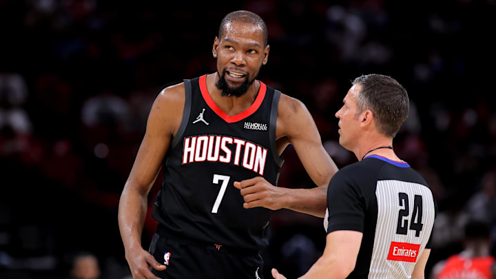 Mar 13, 2026; Houston, Texas, USA; Houston Rockets forward Kevin Durant (7) talks with NBA referee Kevin Scott (24) during a timeout against the New Orleans Pelicans during the first quarter at Toyota Center. Mandatory Credit: Erik Williams-Imagn Images