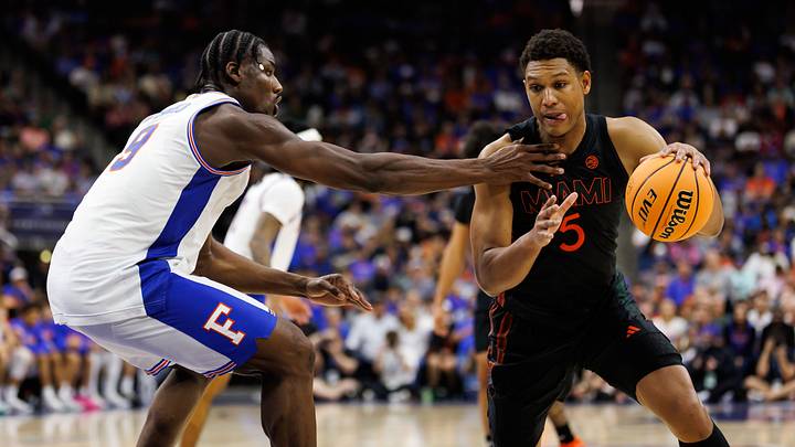 Nov 16, 2025; Gainesville, Florida, USA; Florida Gators center Rueben Chinyelu (9) defends Miami Hurricanes forward Malik Reneau (5) during the second half at VyStar Veterans Memorial Arena. Mandatory Credit: Matt Pendleton-Imagn Images Nov 16, 2025; Gainesville, Florida, USA; Florida Gators center Rueben Chinyelu (9) defends Miami Hurricanes forward Malik Reneau (5) during the second half at VyStar Veterans Memorial Arena. Mandatory Credit: Matt Pendleton-Imagn Images