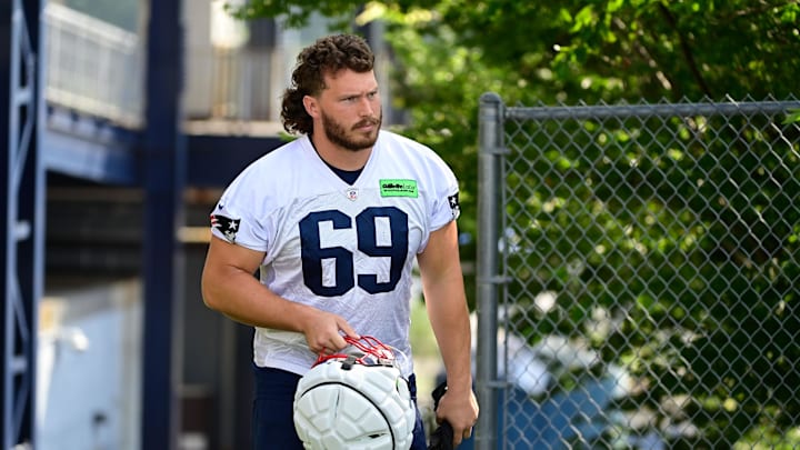 Jul 26, 2023; Foxborough, MA, USA; New England Patriots guard Cole Strange (69) makes his way to the practice fields for  training camp at Gillette Stadium. Mandatory Credit: Eric Canha-Imagn Images