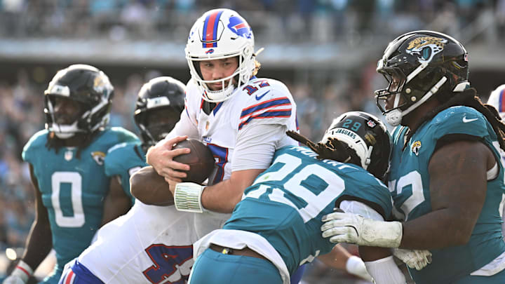 Jan 11, 2026; Jacksonville, FL, USA; Buffalo Bills quarterback Josh Allen (17) runs to score a touchdown during the second half against the Jacksonville Jaguars in an AFC Wild Card Round game at EverBank Stadium.