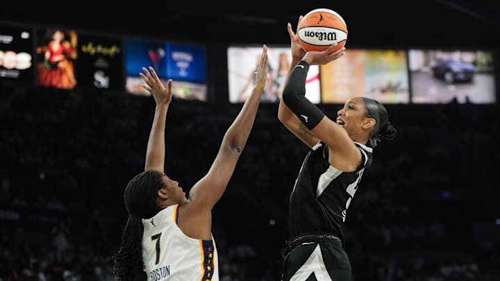 Sep 21, 2025; Las Vegas, Nevada, USA; Las Vegas Aces center A'ja Wilson (22) shoots the ball against Indiana Fever center Aliyah Boston (7) during the third quarter in game one of the second round for the 2025 WNBA Playoffs at Michelob Ultra Arena. Mandatory Credit: Lucas Peltier-Imagn Images Sep 21, 2025; Las Vegas, Nevada, USA; Las Vegas Aces center A'ja Wilson (22) shoots the ball against Indiana Fever center Aliyah Boston (7) during the third quarter in game one of the second round for the 2025 WNBA Playoffs at Michelob Ultra Arena. Mandatory Credit: Lucas Peltier-Imagn Images