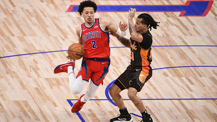 Jan 8, 2022; Detroit, Michigan, USA; Detroit Pistons guard Cade Cunningham (2) drives to the basket as Orlando Magic guard Cole Anthony (50) defends during the second quarter at Little Caesars Arena. Mandatory Credit: Tim Fuller-Imagn Images