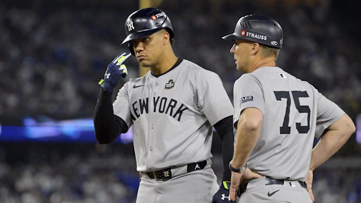 Oct 26, 2024; Los Angeles, California, USA; New York Yankees outfielder Juan Soto (22) reacts at first base after hitting a single in the ninth inning against the Los Angeles Dodgers during game two of the 2024 MLB World Series at Dodger Stadium. Mandatory Credit: Jayne Kamin-Oncea-Imagn Images