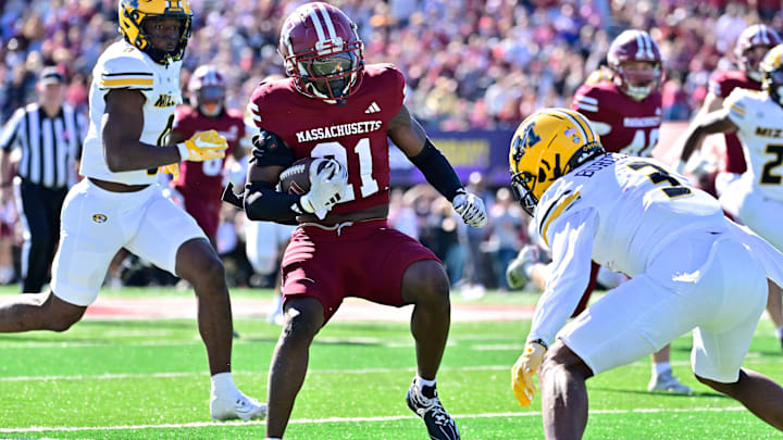 Oct 12, 2024; Amherst, Massachusetts, USA; Massachusetts Minutemen defensive back Te'Rai Powell (21) runs the ball against the Missouri Tigers during the first half at Warren McGuirk Alumni Stadium. Mandatory Credit: Eric Canha-Imagn Images Oct 12, 2024; Amherst, Massachusetts, USA; Massachusetts Minutemen defensive back Te'Rai Powell (21) runs the ball against the Missouri Tigers during the first half at Warren McGuirk Alumni Stadium. Mandatory Credit: Eric Canha-Imagn Images