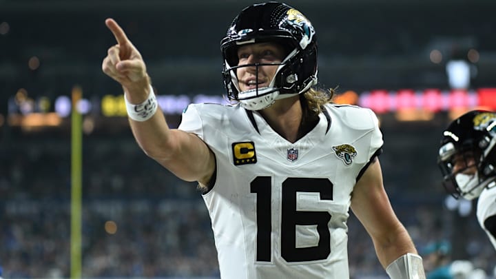 Dec 28, 2025; Indianapolis, Indiana, USA; Jacksonville Jaguars quarterback Trevor Lawrence (16) celebrates after a touchdown against the Indianapolis Colts during the first half at Lucas Oil Stadium.