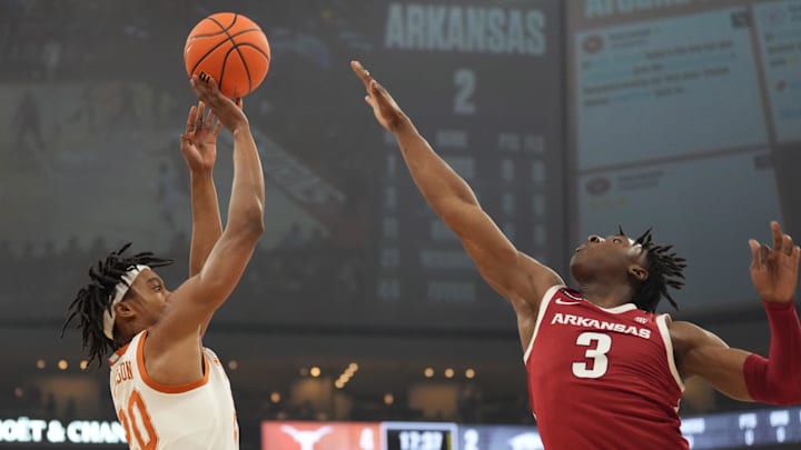 Feb 5, 2025; Austin, Texas, USA; Texas Longhorns guard Tre Johnson (20) shoots over Arkansas Razorbacks forward Adou Thiero (3) during the first half at Moody Center. Mandatory Credit: Scott Wachter-Imagn Images