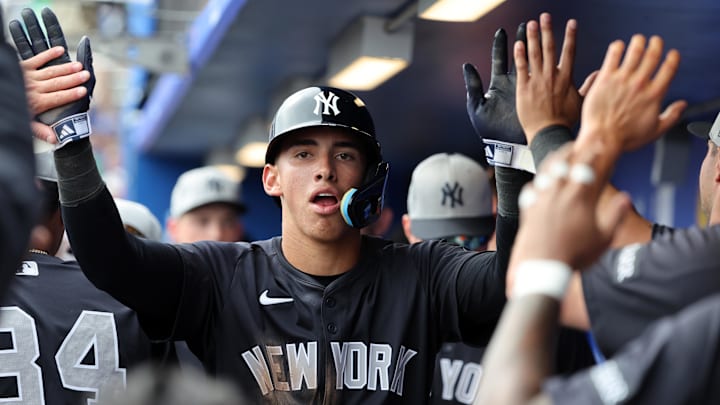 Feb 22, 2025; Dunedin, Florida, USA; New York Yankees shortstop George Lombard Jr. (96) is congratulated after he scored a run during the sixth inning against the Toronto Blue Jays at TD Ballpark. Feb 22, 2025; Dunedin, Florida, USA; New York Yankees shortstop George Lombard Jr. (96) is congratulated after he scored a run during the sixth inning against the Toronto Blue Jays at TD Ballpark.