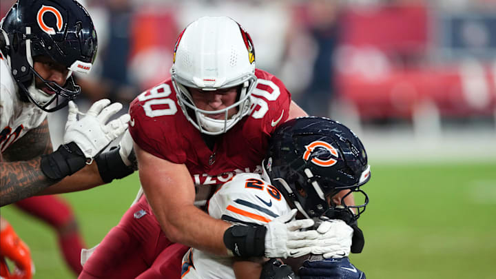 Nov 3, 2024; Glendale, Arizona, USA; Arizona Cardinals defensive end Ben Stille (90) tackles Chicago Bears running back Roschon Johnson (23) during the second half at State Farm Stadium.