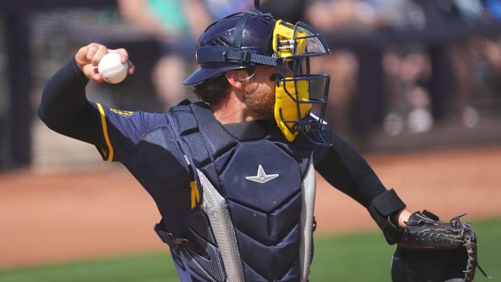 Mar 14, 2024; Peoria, Arizona, USA; Milwaukee Brewers catcher Eric Haase (13) throws to second base against the Seattle Mariners during the second inning at Peoria Sports Complex. Mandatory Credit: Joe Camporeale-USA TODAY Sports