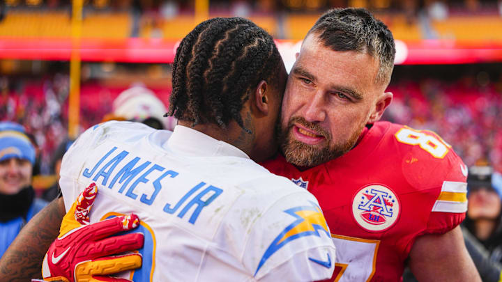 Dec 14, 2025; Kansas City, Missouri, USA; Kansas City Chiefs tight end Travis Kelce (87) talks with Los Angeles Chargers safety Derwin James Jr. (3) following a Chargers victory at GEHA Field at Arrowhead Stadium. Mandatory Credit: Jay Biggerstaff-Imagn Images