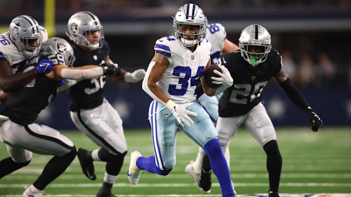 Dallas Cowboys running back Malik Davis runs the ball against the Las Vegas Raiders.
