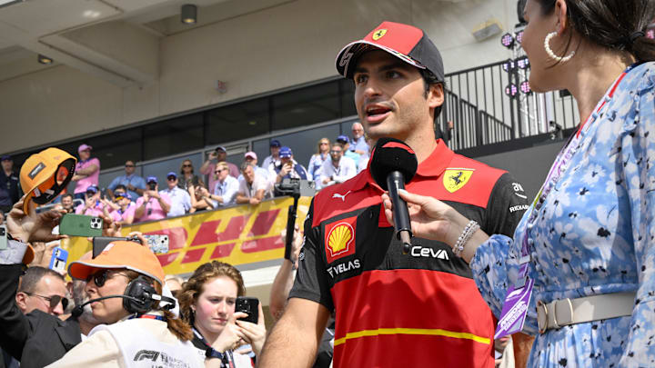 Oct 23, 2022; Austin, Texas, USA; Scuderia Ferrari driver Carlos Sainz (55) of Team Spain walks on to the track before the running of the U.S. Grand Prix F1 race at Circuit of the Americas. Mandatory Credit: Jerome Miron-Imagn Images