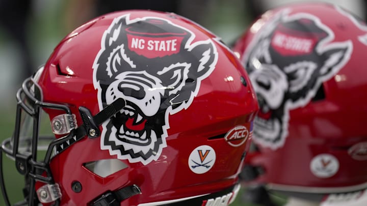 Dec 30, 2022; Charlotte, NC, USA; North Carolina State Wolfpack helmets during the first half against the Maryland Terrapins in the 2022 Duke's Mayo Bowl at Bank of America Stadium. Mandatory Credit: Jim Dedmon-Imagn Images Dec 30, 2022; Charlotte, NC, USA; North Carolina State Wolfpack helmets during the first half against the Maryland Terrapins in the 2022 Duke's Mayo Bowl at Bank of America Stadium. Mandatory Credit: Jim Dedmon-Imagn Images
