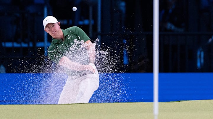 Rory McIlroy plays a sand shot for Boston Common GC. 