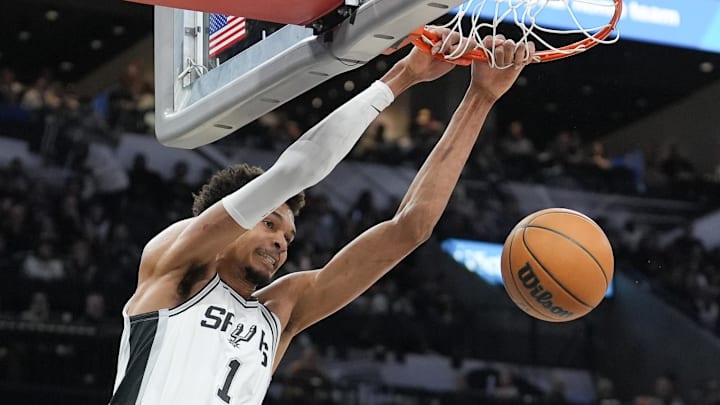 Jan 17, 2025; San Antonio, Texas, USA; San Antonio Spurs center Victor Wembanyama (1) dunks the ball in the second half against the Memphis Grizzlies at Frost Bank Center. Mandatory Credit: Daniel Dunn-Imagn Images