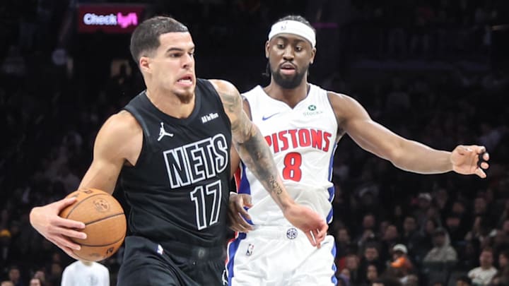 Nov 7, 2025; Brooklyn, New York, USA;  Brooklyn Nets forward Michael Porter Jr. (17) looks to drive past Detroit Pistons guard Caris LeVert (8) in the third quarter at Barclays Center. Mandatory Credit: Wendell Cruz-Imagn Images