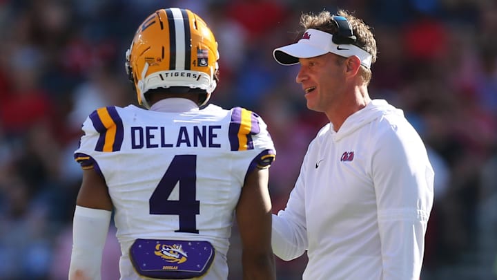 Sep 27, 2025; Oxford, Mississippi, USA; Mississippi Rebels head coach Lane Kiffin talks with LSU Tigers cornerback Mansoor Delane (4) during the second quarter at Vaught-Hemingway Stadium. Sep 27, 2025; Oxford, Mississippi, USA; Mississippi Rebels head coach Lane Kiffin talks with LSU Tigers cornerback Mansoor Delane (4) during the second quarter at Vaught-Hemingway Stadium.