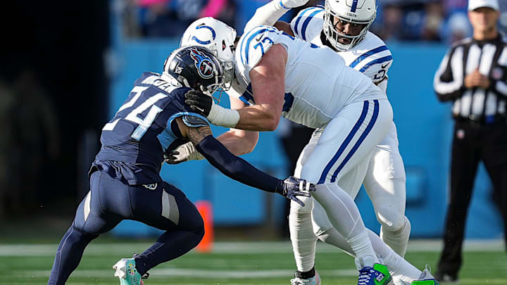 Tennessee Titans cornerback Elijah Molden (24) tries to navigate around Indianapolis Colts offensive tackle Blake Freeland (73) but is unable to get the first down Sunday, Dec. 3, 2023, at Nissan Stadium in Nashville, Tenn.