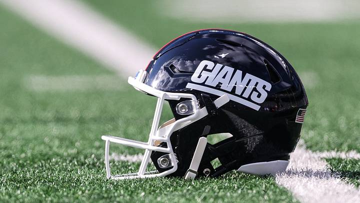 A New York Giants helmet rests on the field A New York Giants helmet rests on the field