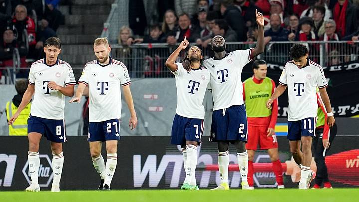 Bayern Munich players celebrating a goal against Freiburg on matchday 7 of the Bundesliga.