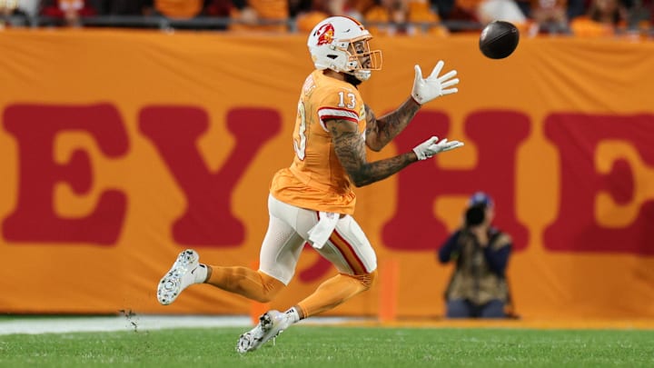 Dec 11, 2025; Tampa, Florida, USA; Tampa Bay Buccaneers wide receiver Mike Evans (13) catches a thirty-three yard pass thrown by quarterback Baker Mayfield (6) against the Atlanta Falcons during the second quarter at Raymond James Stadium.