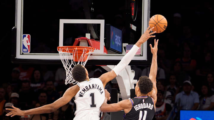 Nov 2, 2025; Phoenix, Arizona, USA; San Antonio Spurs forward Victor Wembanyama (1) blocks Phoenix Suns forward Oso Ighodaro (11) during the first half