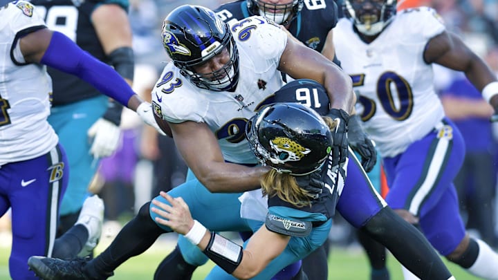 Baltimore Ravens defensive tackle Calais Campbell (93) takes Jacksonville Jaguars quarterback Trevor Lawrence (16) to the turf with under two minutes to play in the game. The Jacksonville Jaguars hosted the Baltimore Ravens at TIAA Bank Field in Jacksonville, FL Sunday, November 27, 2022. The Jaguars got momentum late in the game to win 28 to 27 over the Ravens. [Bob Self/Florida Times-Union]

Jki 112722 Bs Jaguars Vs R 18