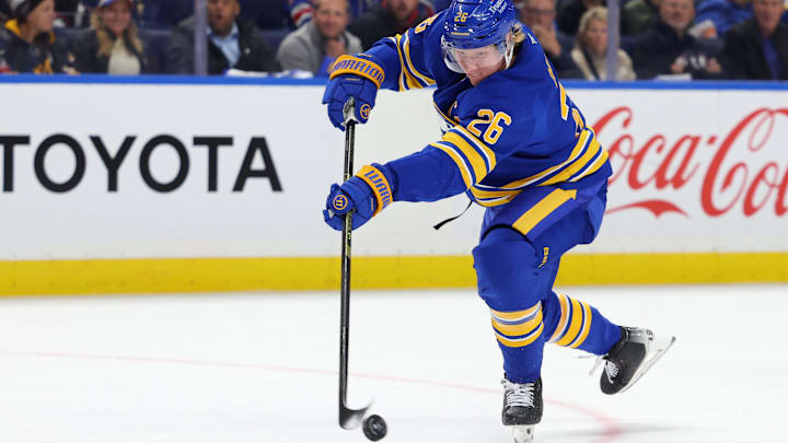 Oct 9, 2025; Buffalo, New York, USA;  Buffalo Sabres defenseman Rasmus Dahlin (26) takes a shot on goal during the first period against the New York Rangers at KeyBank Center. Mandatory Credit: Timothy T. Ludwig-Imagn Images